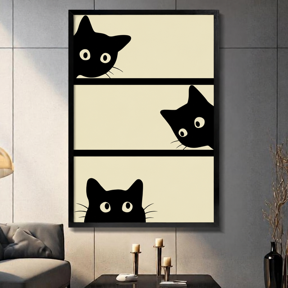 Black framed canvas print of three curious black cats peeking over edges of three beige horizontal panels in minimalist cartoon style, displayed on grey wall above console table with candles

