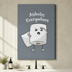 Humorous canvas wall art with expressive cartoon toilet paper roll and Assholes Everywhere quote on dusty blue background, hung above a bathroom vanity without frame