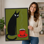 Woman holding a large framed folk art print of a black cat and steaming red coffee cup on olive green, showcasing print size and quality