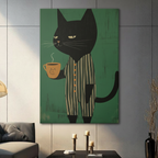 Gallery-wrapped canvas art of a grumpy black cat wearing striped pajamas with a coffee mug on green background, hung in a contemporary living room setting
