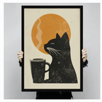 Close-up of a black cat and coffee mug framed art print in linocut style with an orange sun background, held up to show print detail and black frame