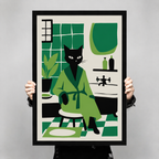 Person holding a large framed black cat in green bathrobe bathroom art print to show scale and size