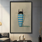 Whimsical black cat peeking out of blue striped mug, framed canvas wall art in black frame hung on grey tile wall in modern living room