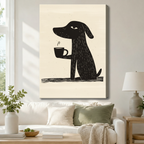 Quirky black dog with coffee mug minimalist linocut gallery wrapped canvas hung above a white sofa with sage green cushions and ceramic table lamp in a cozy neutral living room