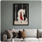 Framed fantasy art print of a red-hooded figure nestled against a white wolf in a dark snowy forest, styled above a neutral linen sofa on a sage green wall