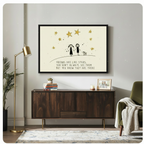 Framed minimalist friendship quote wall art of two stick figure girls holding hands with a dog and gold stars on a cream background, displayed above a dark walnut sideboard in a mid-century modern living room