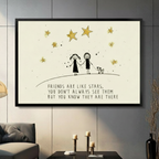 Framed friendship quote wall art print with two smiling stick figure girls holding hands with a small dog under golden stars, text reads "Friends Are Like Stars", displayed above a console table on a dark gray living room wall