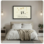 Black-framed friendship quote canvas print of two smiling stick figure girls with a dog under gold stars, hung as a warm statement wall art piece above a bed in a cozy neutral-toned modern bedroom