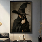 Gothic witch holding black cat framed canvas wall art displayed in a moody dark academia living room with candleholders