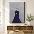 Grumpy purple pigeon "Eat?" framed canvas wall art hung above rattan console in bright modern entryway