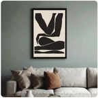 Framed black and cream abstract figure canvas print above linen sofa on sage green wall - minimalist body silhouette wall art with bold geometric form for modern living room styling