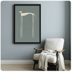Framed minimalist whippet art print with elongated cream line-art dog on blue-grey background, displayed beside a white linen armchair in a calm Scandinavian-style reading nook