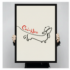 Framed canvas art print of dachshund one-line drawing with red Oui-Ner lettering, held up showing full artwork detail and black frame