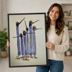 Woman smiling holding large framed quirky blue long-necked bird flock wall art print with red crest detail