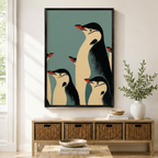 Retro penguin family portrait framed wall art above a wicker basket sideboard, mid-century modern black and cream emperor penguins on teal blue background