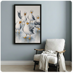 Black framed whimsical coastal seagull gang humor canvas print with five cartoon gulls showing off their personalities in shallow water hung on a soft blue-gray wall beside a white linen wood lounge chair with cream throw