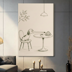 Funny pencil sketch long-nose dachshund sitting on chair reaching for croissant and coffee cup on round cafe table gallery wrap canvas art on warm cream background on a dark gray paneled wall above a charcoal sofa with candle holders