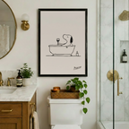 Snoopy bathtub wine art framed print above toilet in marble bathroom - humorous dog line art wall decor with brass fixtures