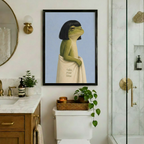 Black framed whimsical frog with bob haircut and cream take your time towel canvas art hung above a toilet in an elegant bathroom with brass fixtures, marble vanity, round mirror, and glass shower enclosure