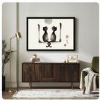Black-framed ink wash art print of two cats under a moon displayed above a dark walnut sideboard in a modern living room with gold floor lamp — Asian-inspired home decor