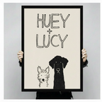 Hand-held black framed Huey and Lucy dog sketch art print showing full artwork size detail and print quality