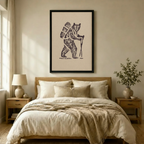 Framed vintage-style bear hiker wall art print hung above a neutral linen bedroom bed, earthy tones with minimalist Japandi interior styling