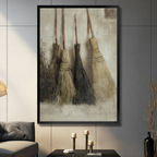 Four rustic witch brooms leaning against beige wall, vintage oil painting style black framed wall art print displayed in modern living room with candlestick decor
