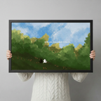 Person holding a black framed whimsical black and white cat duo art print with green meadow and blue sky quote "With you every path is home" against a light gray backdrop