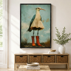 Black framed whimsical heron wearing red lace-up boots and cream skirt vintage wall art print displayed above a rattan storage console in a bright entryway