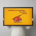 Person in a cream knit sweater holding a large horizontal black framed whimsical raccoon knight My King canvas art print with a small hunched raccoon in a red cloak charging with a long sword on its back on a vivid golden yellow background with dark red medieval hand-lettered I Will Follow You My Brother My Captain My King quote signed Killroy