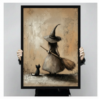 Hands in black sleeves holding a large black framed vintage witch with broomstick and black cat canvas art print against a neutral gray background, front-facing vertical product size display