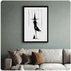 Witch silhouette with black cat framed wall art print in living room with sage green wall and neutral sofa